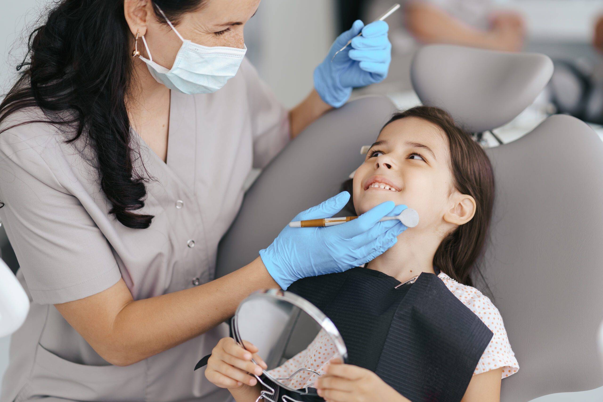 Dentist caring for girl